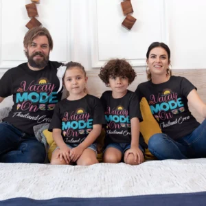 Family of four wearing matching black “Vacay Mode On” personalized vacation T-shirts sitting together, perfect for travel and holiday photos