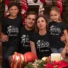 Family of four wearing matching black personalized Vacay Squad Goa 2026 vacation T-shirts for holiday trip
