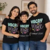 Parents and child wearing matching black Vacay Mode On Kodaikanal 2026 family vacation T-shirts