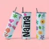 Custom floral tumbler with colorful flowers and personalized name printed on a slim drink cup with straw