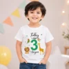 Kid wearing a personalized jungle safari birthday t-shirt with name Aayan and age 3 featuring lion, giraffe, and animal illustrations