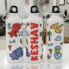 Personalized kids water bottle with cute dinosaur cartoon design and name printed vertically on white bottle