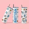 Personalized kids tumbler with space theme design featuring astronaut illustrations and custom name printed vertically