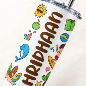 Close-up of personalized kids tumbler with RIDHAAN name, brown lettering and colorful beach-themed illustrations on a white surface.