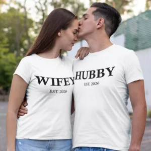 Couple wearing matching white Wifey and Hubby T-shirts with custom established year, ideal for prewedding and anniversary photoshoot