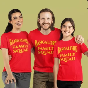 Family wearing matching red RCB family squad t-shirts with lion graphic for cricket match day and outings