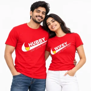 Indian couple wearing matching red HUBBY and WIFEY T-shirts with bold white lettering, curved swoosh graphics, yellow hearts, and JUST LOVE HIM text.