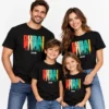 Family vacation T-shirts with matching black Dubai 2026 skyline prints worn by two adults and two children on a light studio background.
