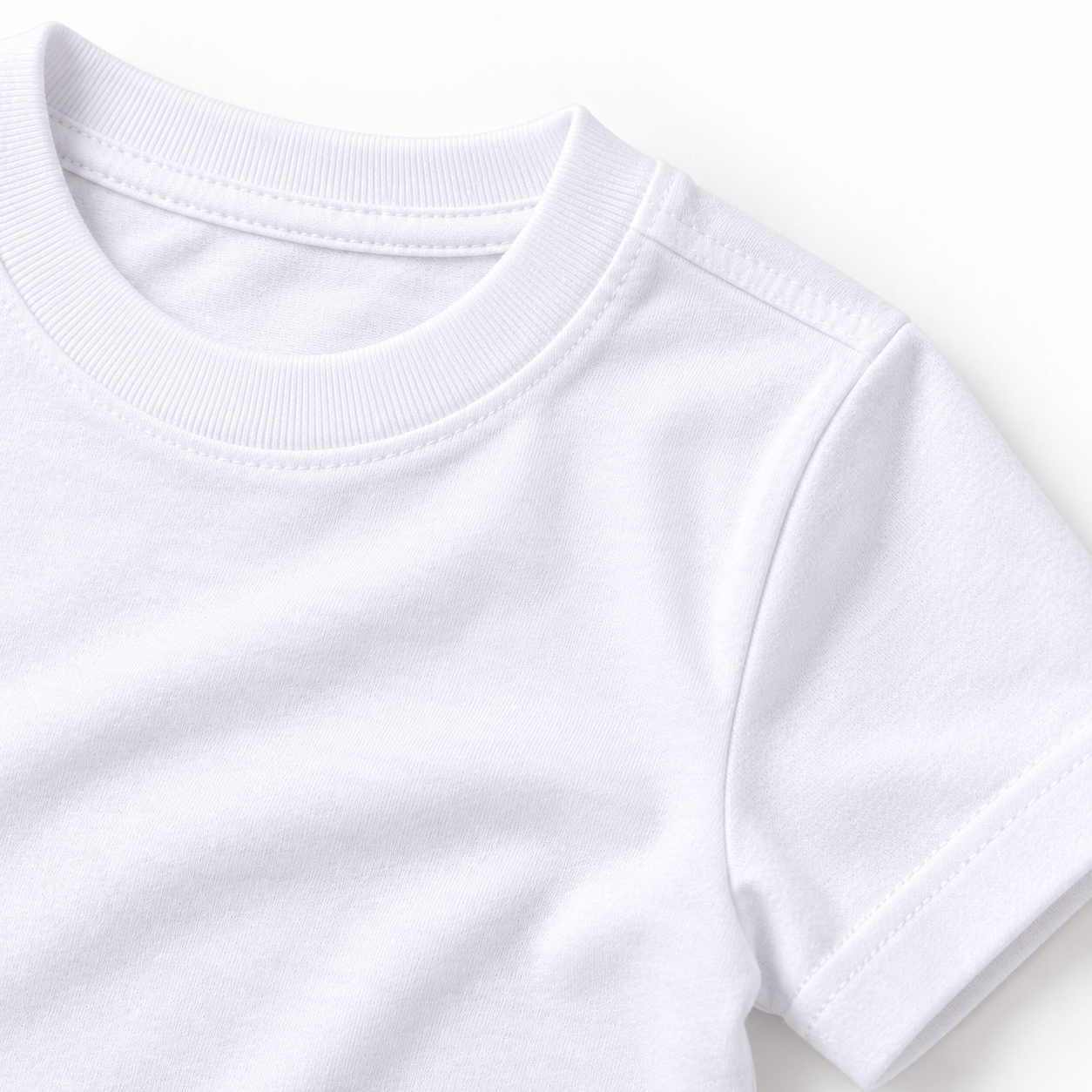 Close-up of white kids t-shirt fabric showing ribbed crew neckline, shoulder stitching, sleeve hem, and cotton texture