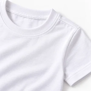 Close-up of white kids t-shirt fabric, ribbed crew neckline, shoulder seam, and sleeve stitching detail