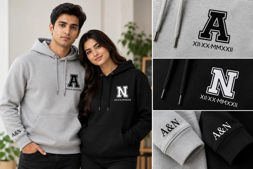 Couple wearing grey and black personalized hoodies with A and N chest initials, Roman numeral dates and matching A&N sleeve prints.