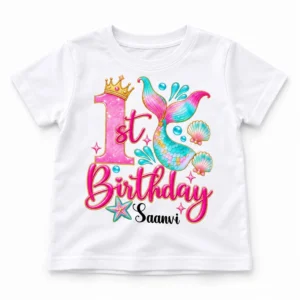 Flat lay of a white personalized 1st birthday kids t-shirt showing the full front mermaid birthday print with the name Saanvi