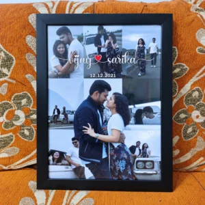 Personalized couple photo collage in a black frame with names, special date and romantic memories, displayed on an orange sofa.