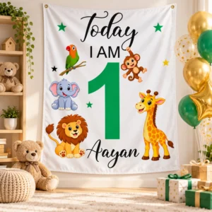 Personalized Aayan first birthday tapestry with age 1 and jungle animals displayed with green and gold balloons, gifts, and nursery decor.