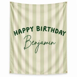 Personalized kids birthday tapestry banner with sage green and cream vertical stripes, dark green Happy Birthday text, Benjamin name, and four corner grommets.