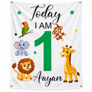 White personalized kids birthday tapestry banner with Aayan name, large green age 1, jungle animals, stars, and four corner grommets.