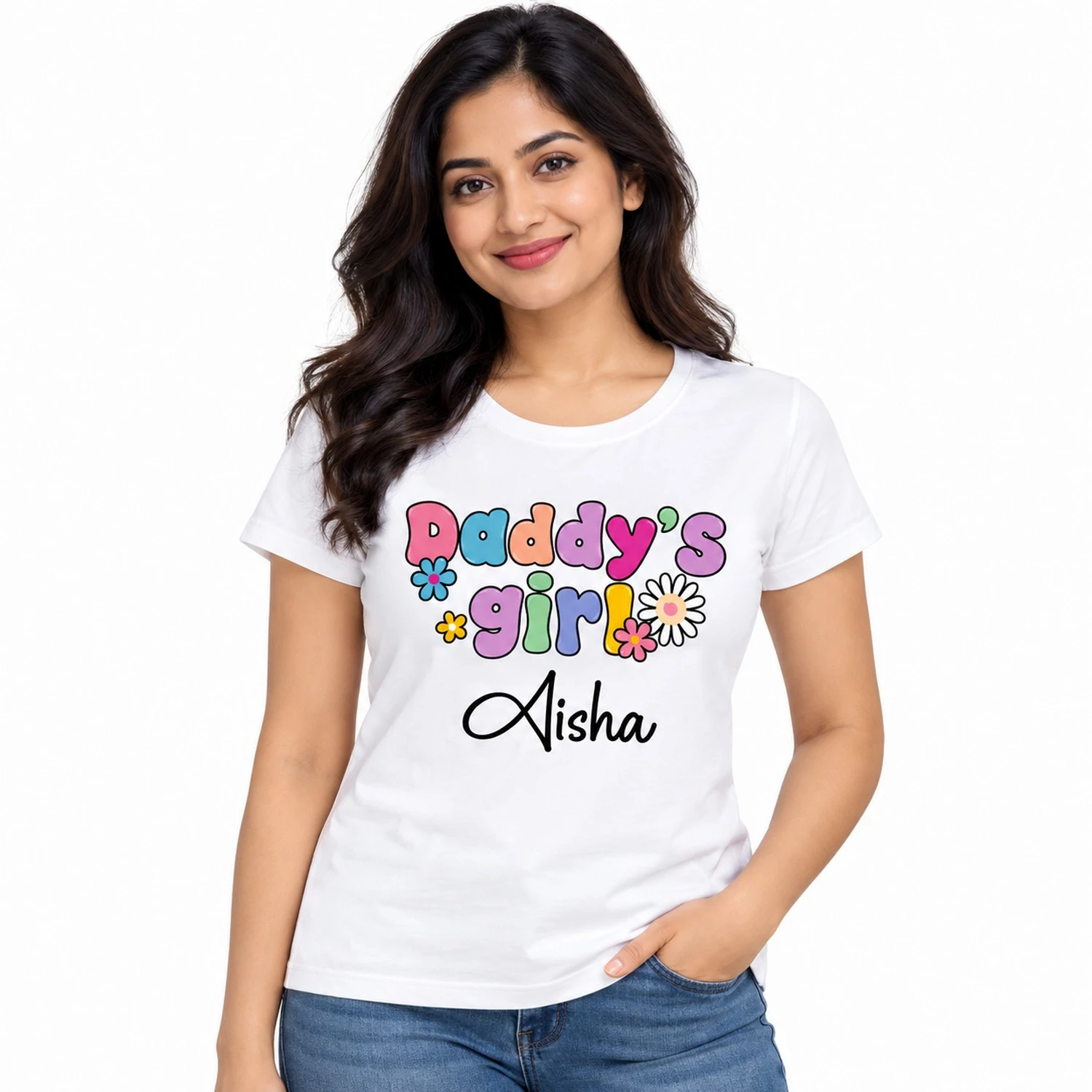 Indian woman wearing a white personalized name print T-shirt with colorful Daddy's Girl lettering, floral designs, and the name Aisha in black script.