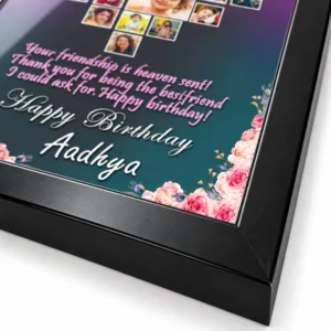 Close-up of the black personalized photo frame corner showing the mitered frame join, printed floral artwork, custom birthday text, and glossy surface.