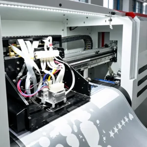 Close-up of industrial printing equipment, ink tubes and printer carriage inside Printgen's production house.