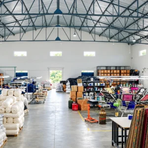 Spacious Printgen production house interior with textile printing equipment, materials and organized work areas.